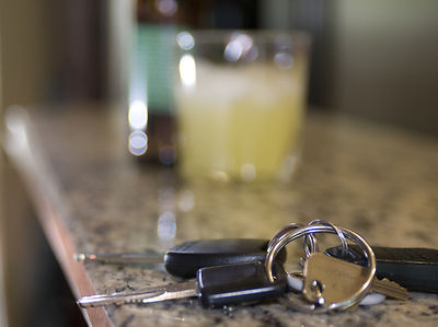 Car keys and a bottle of beer